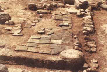 A building site with the ground paved with traditional bricks